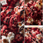 Festive red velvet popcorn decorated with dark candy drizzle as an easy Halloween popcorn treat.